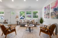 Bright living room with freshly painted white walls and trim