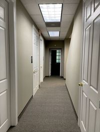 Office hallway with freshly painted walls and doors