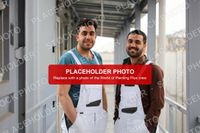Placeholder stock photo of two painters in white overalls