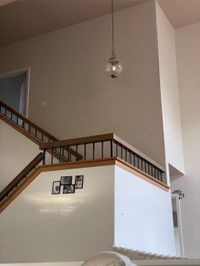 The same stairwell wall finished in one even coat of paint