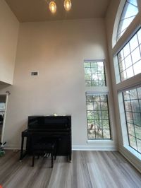 The two-story wall finished in a smooth, even coat