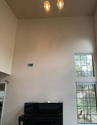 The two-story wall finished in a smooth, even coat